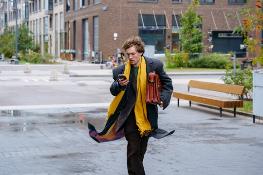 Business professional rushing through city
