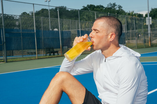 Drinking electrolyte drink after workout