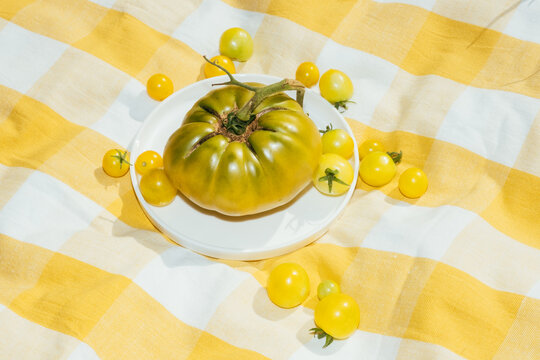 Green Heirloom tomato and yellow cherry tomatoes