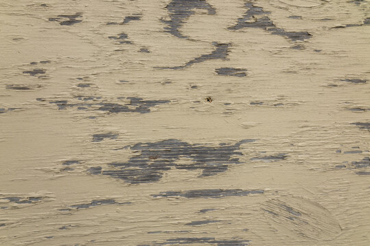 Weathered Yellow Paint Peeling From Aged Wooden Surface With Texture