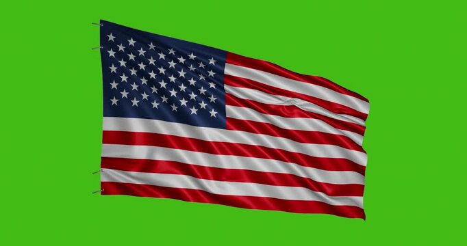 Waving american flag on a green background in bright daylight