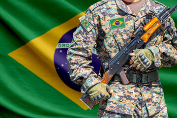 Obraz premium Brazil flag with soldier holding assault rifle