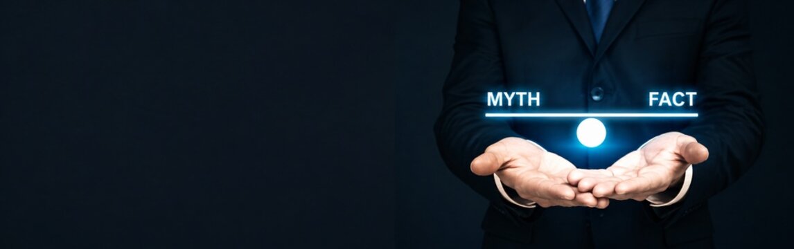 Myth vs Fact concept with businessman holding glowing balance scale. Truth and misinformation comparison. Professional decision making.