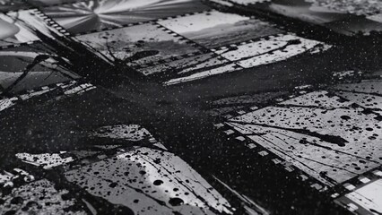 Fototapeta premium Abstract black and white pattern of distressed metal surfaces, showing textures and layered panels, perfect for industrial backgrounds or grunge aesthetics, dramatic visual element