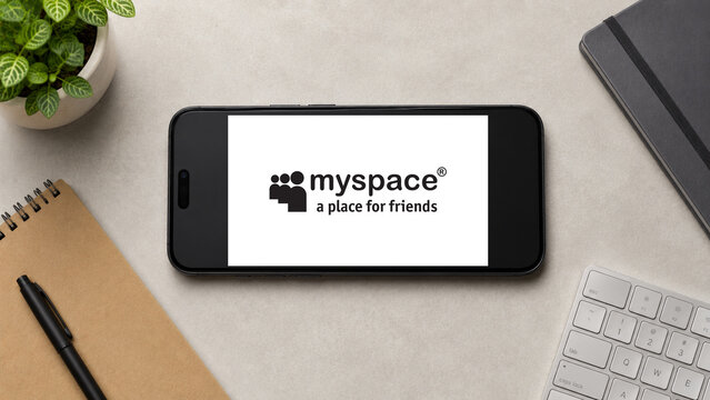 In this photo illustration, a horizontally placed smartphone displays the Myspace app logo on a minimalist office desk, in Guwahati, India on 13 August 2026.