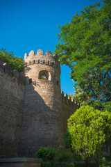 Obraz premium Medieval Baku Fortress wall and defense stone tower with sky copy space