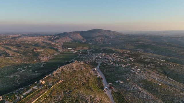 Aerial drone view of the historic ruins of Qal'at Semaan in Syria. Ancient stone architecture and arches at the Church of Saint Simeon Stylites. Famous archaeological site.