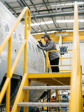 Technician Riveting a Fuselage Panel