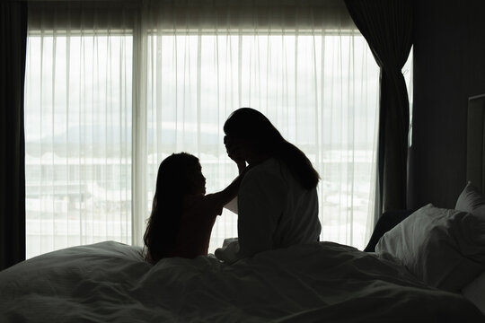 Portrait of mother taking care of child feeling tired stressed at home	
