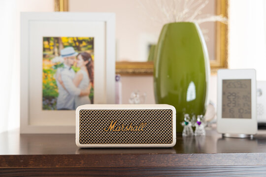 Marshall Emberton III cream wireless bluetooth speaker on shelf in home interior cozy background