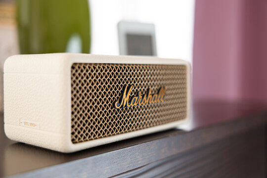 Marshall Emberton III cream wireless bluetooth speaker on shelf in home interior cozy background