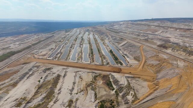 Hambach open pit mine operation area, mining lignite with solar panel photovoltaic modules, change to renewable sustainable energy