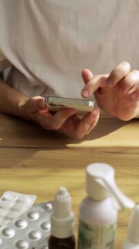 Woman Using Smartphone to Refill Prescription Medication Online