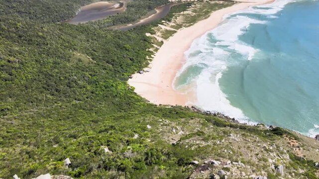 Drone Master Aerial View of Lagoinha do Leste Horseshoe Beach and Lagoon in Florianopolis Brazil, Pristine Atlantic Forest Mountain Coastline and Turquoise Ocean Waves, Wilderness Summer Travel Footag