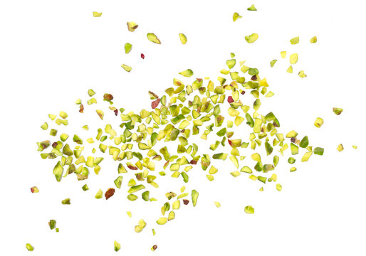 Pistachios chopped scattered, pile isolated on white background and texture, top view, clipping path