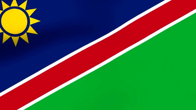 Waving national flag of Namibia featuring yellow sun on blue and green background