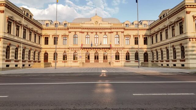 Pan of the Bacău Prefecture, also known as the Administrative Palace &mdash; a grand neoclassical government building in Romania under a dramatic evening sky.