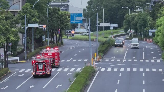 Tokyo,Japan -August 13, 2026:Two fire engines  running in Tokyo in the morning
