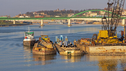 Old Barges Loaded With Construction Material Debris and Pipes at Sava River Belgrade © markobe