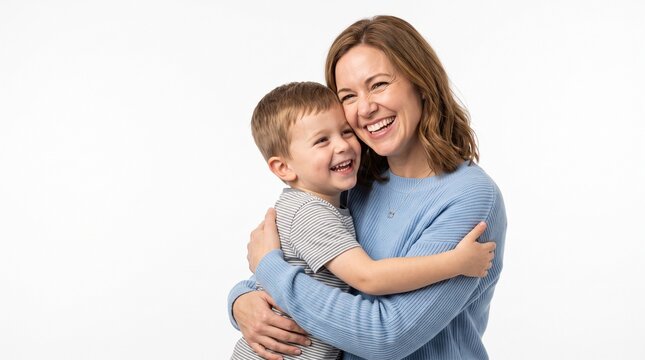 Joyful mother and son embracing tightly with happy smiles against a clean white background