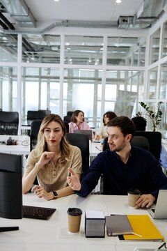 Diverse business team talking together during a collaborative office meeting