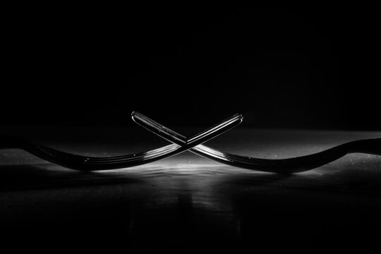 two forks close up, food,cooking, dinner, restaurant concept,. monochrome image