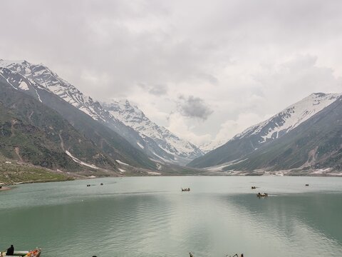 Jheel Saif Ul Malook
Lake with crystal clean water having natural green grassy Mountains with its snow fall upon it and cloudy sky background
Beautiful Lake Saif Ul Malook Naran Valley of KPK Pakistan