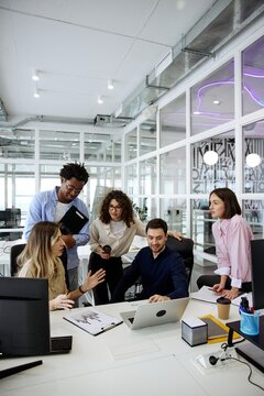 Diverse business team discussing work during a collaborative office meeting