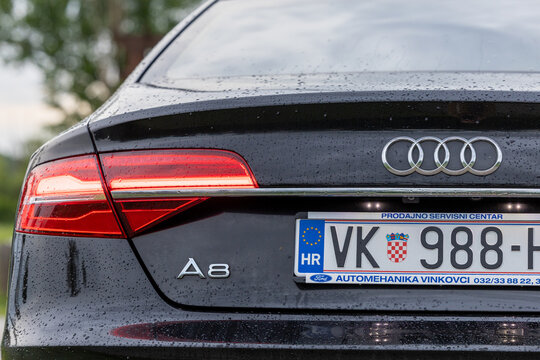 Audi A8 Rear Close-Up With Croatian License Plate and Wet Taillight in Rain
