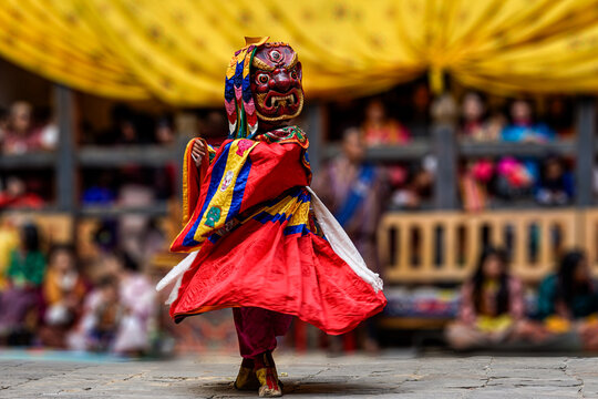 Bumthang in Bhutan, at the yearly festival in the monastery of Jakar. A monk is dancing in his colourful traditional dress and mask