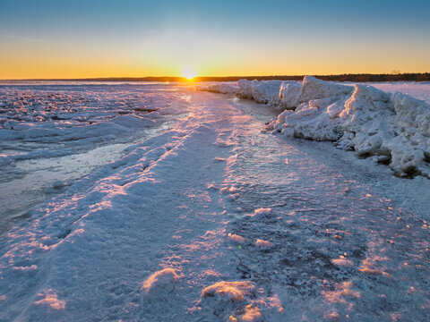 Ice toros on the Baltic Sea beach in Mikoszewo at sunrise. Poland