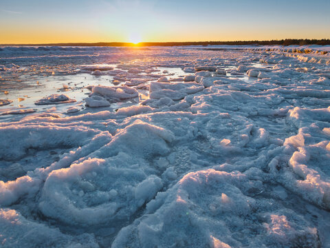 Ice toros on the Baltic Sea beach in Mikoszewo at sunrise. Poland