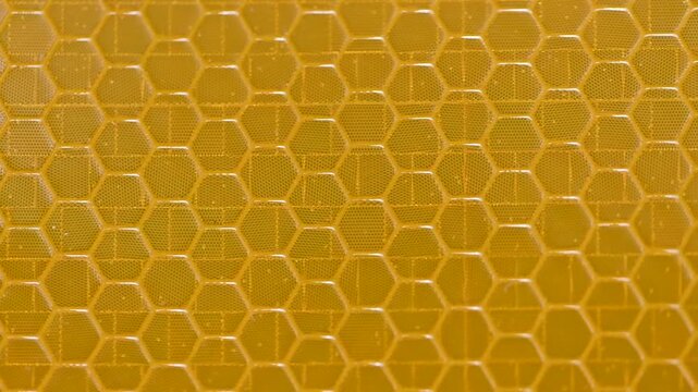 Yellow and Amber Reflective Safety Tape Patterns Close-Up