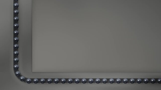 Mirror Bead Race Indexing Along An L Shaped Groove Border With Copy Space Seamless Loop in subtle porcelain tones