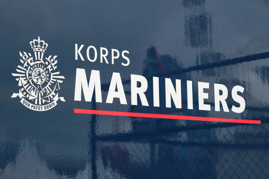 Close-up view of the Korps Mariniers insignia and text. The Korps Mariniers is the naval infantry corps of the Royal Netherlands Navy and one of the oldest branches of the Dutch armed forces.