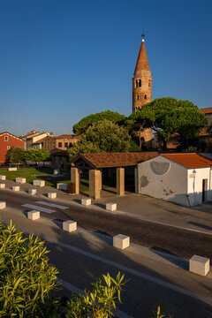 Leaning bell tower in the city of Caorle, Italy, at a beautiful sunrise