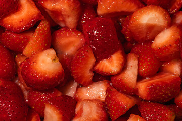 Juicy strawberry slices in sweet natural sugar syrup close up, horizontal background of freshly macerated berries for dessert topping and jam recipe © Ol-Ni