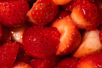 Macro horizontal shot of glossy strawberry slices coated in sweet clear sugar glaze, selective focus close up background of sparkling fruit jam dessert © Ol-Ni