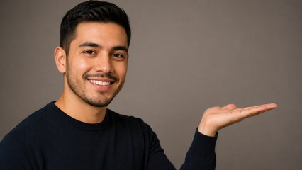 Fototapeta premium Smiling Young Man Presenting Empty Copy Space With Open Hand