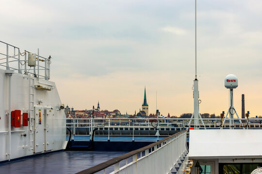 Tallinn, Estonia, March 24th, 2025. Tallinn Old Town skyline and St Olaf's Church seen from passenger ferry deck at Old City Harbour
