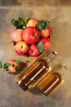 Apple cider with fruit in baskets, Thanksgiving decorations and country harvest, healthy natural food and home canning concept, long-term storage at home, banner for a screen, business card for a cafe