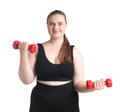 Happy overweight woman with dumbbells on white background