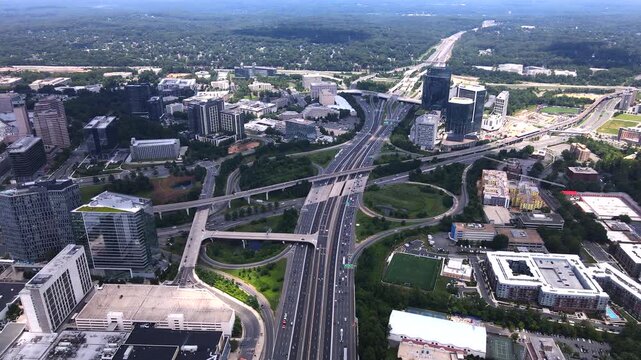Interstate 495 Traffic Passing Office Towers and Metro Tracks in Tysons Virginia.
