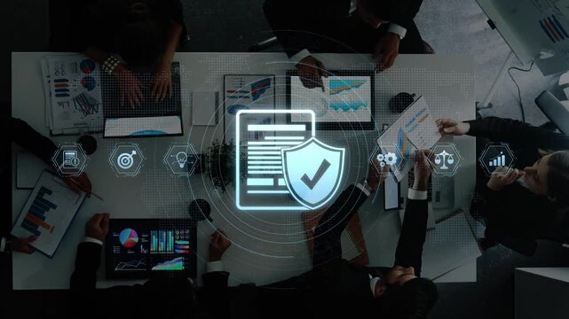 A professional business meeting focused on data security and analytics strategy featuring various screens and digital elements to enhance discussion and collaboration. Raster