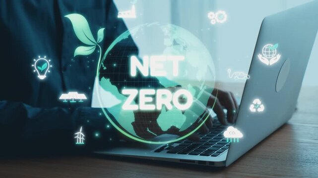 A professional is engaged on a laptop, surrounded by digital symbols of sustainability and net zero. The graphics include green leaves and a globe, emphasizing environmental commitment. Qubit