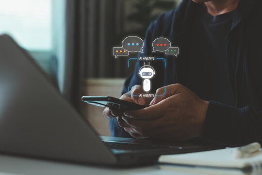 AI agent concept. Businessman using a smartphone and laptop with digital chatbot interfaces, representing artificial intelligence, automation, virtual assistance, smart technology, and communication.