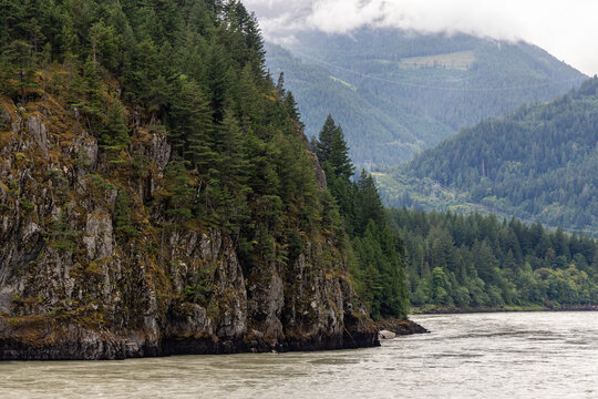 Misty River Gorge With Forested Cliff and Mountain Ridges Near Yale, BC Canada