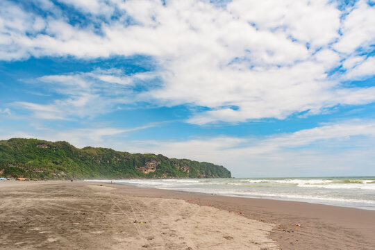 Parangtritis tropical beach with blue sky and clouds