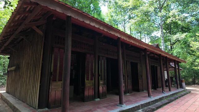 Reconstruction of a traditional Southern Vietnamese house in the forest of Cu Chi Tunnels. Historic site near Ho Chi Minh City.