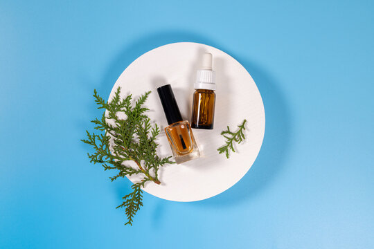 Natural beauty products with dropper bottle and nail polish